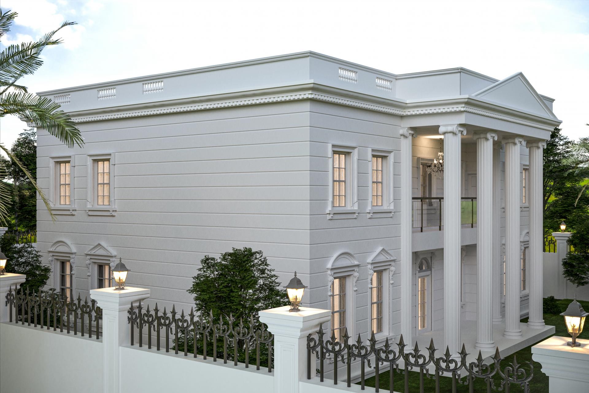 Esterno di villa bianca neoclassica con colonne in poliuretano, stipiti decorativi e cornici sottotetto.
