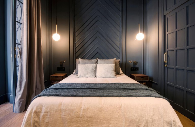 Dramatic Bedroom with Chevron Patterned Anthracite Panel Design