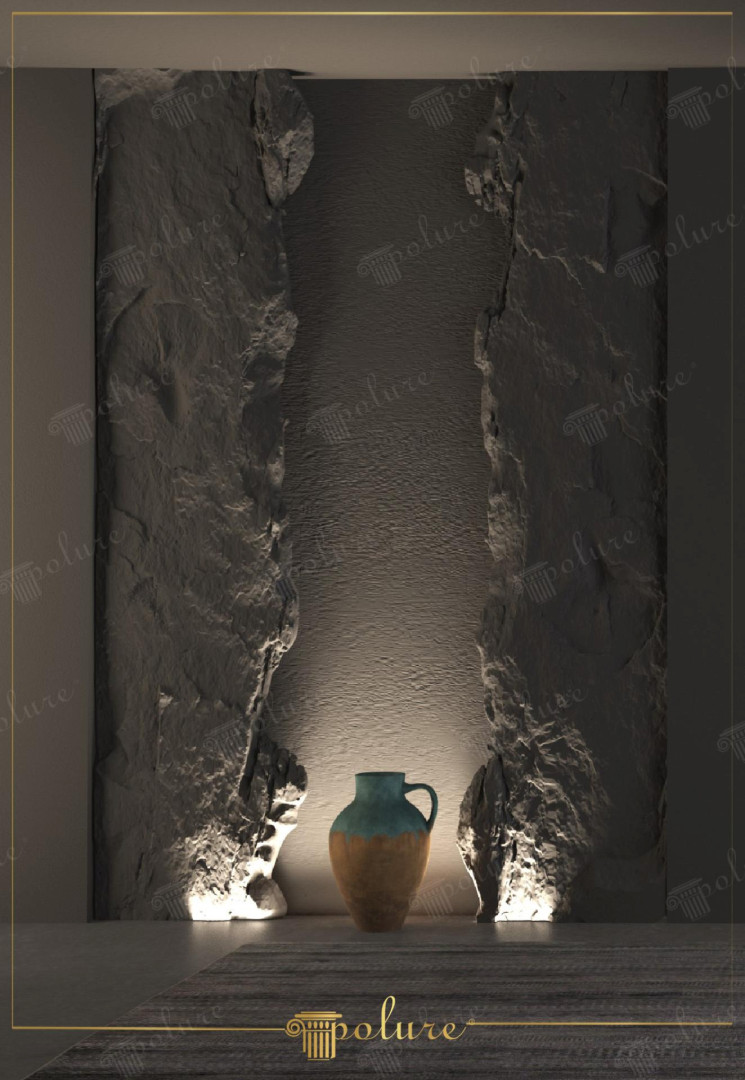 Parete interna moderna con pannelli in poliuretano Polure P3004 effetto roccia e illuminazione LED dal basso.