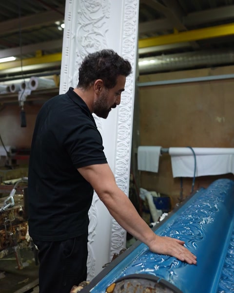 Blue silicone negative mould showing reverse of cornice pattern