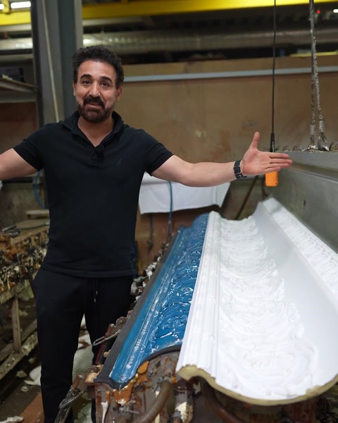Presenting the curved cornice still resting in its open mould