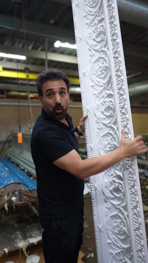 Hand runs along rose rosette pattern on freshly demoulded cornice