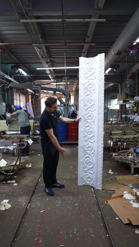 Full cornice piece standing upright in wide workshop view