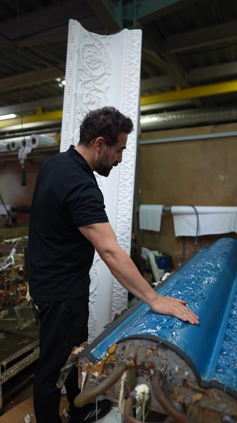 Blue silicone negative mould showing reverse of cornice pattern
