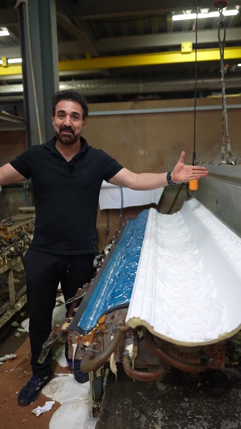 Presenting the curved cornice still resting in its open mould