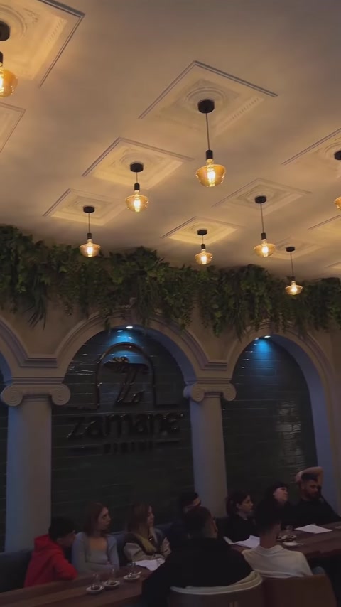 Interior completed with columned arches, ceiling trim and pendant lights