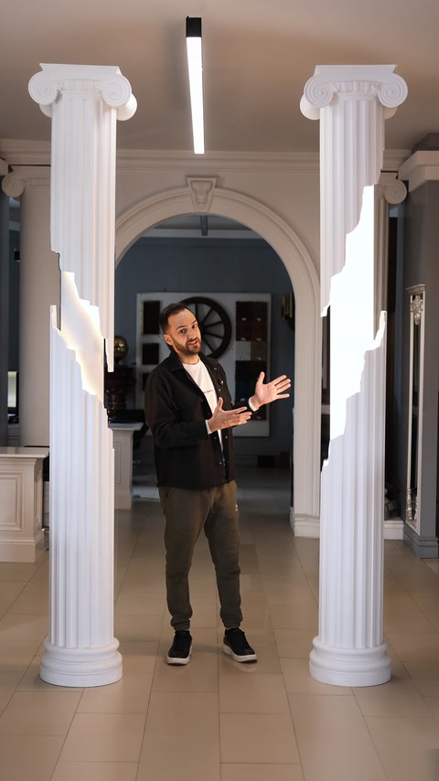 White column applications with classical capitals displayed in an arched passageway