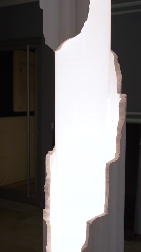 Curved edge detail highlighted by lighting on a decorative column