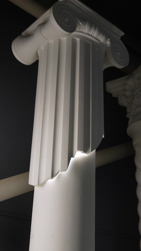 Combination of a fluted pilaster surface and an illuminated lower section