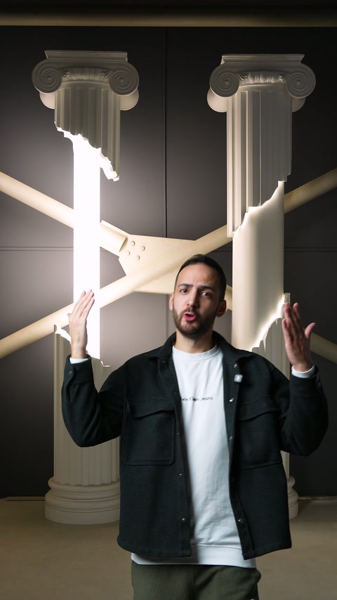 Presenter demonstrates cross lighting application on classical capital columns
