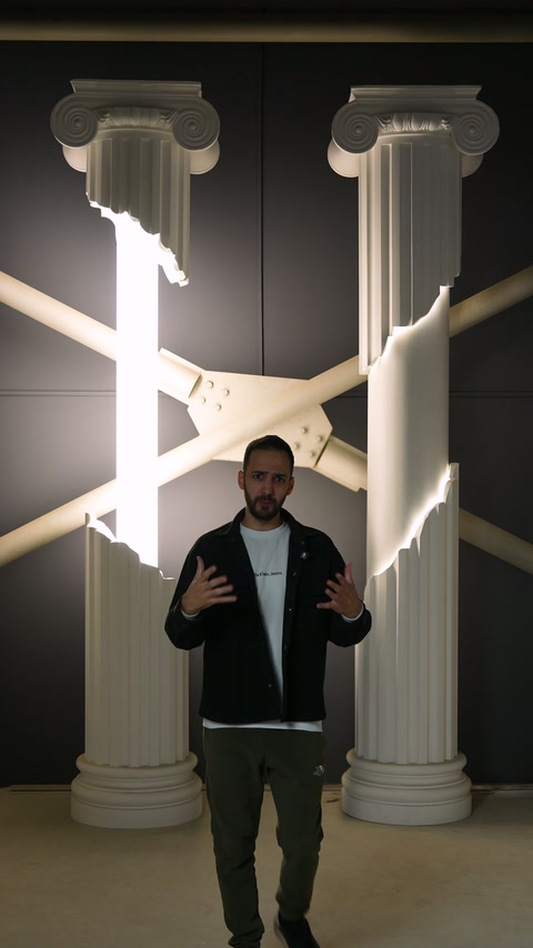 Wide shot of presenter and completed illuminated column installation