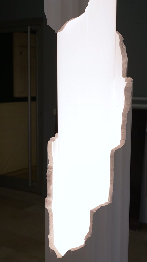 Close-up of bright plexiglass section with irregular edges on column body