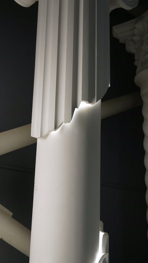 Close-up of hidden lighting line crossing diagonally through column body