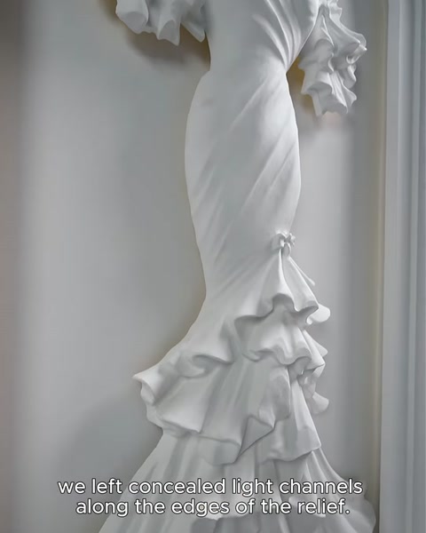 Close-up of ruffled dress hem showing concealed backlight recess edge.