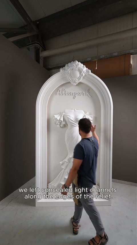 Craftsman indicates concealed lighting paths surrounding the raised bridal-gown decoration.