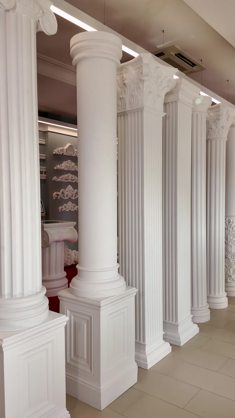 Fluted columns with Corinthian acanthus-leaf capitals standing in showroom