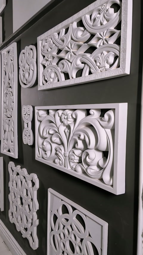 Framed openwork panels feature scrolling leaves and symmetrical floral motifs.