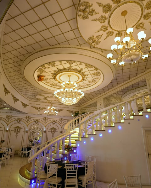 Lobby with coffered round ceiling medallion and chandelier lighting