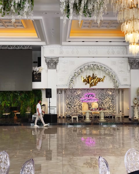 Staircase lobby with columned arch and coffered ceiling ornamentation