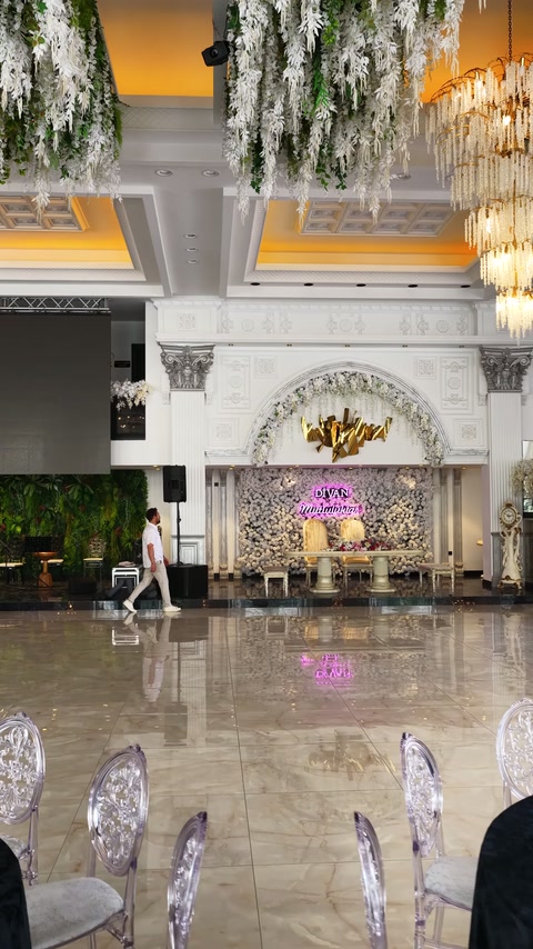 Grand wedding hall adorned with ceiling rose, cornices and columns