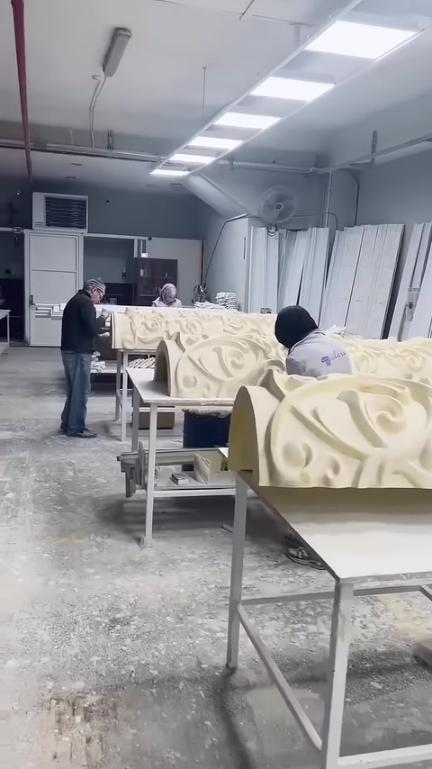 Decorative column bases prepared at different stages on workshop benches