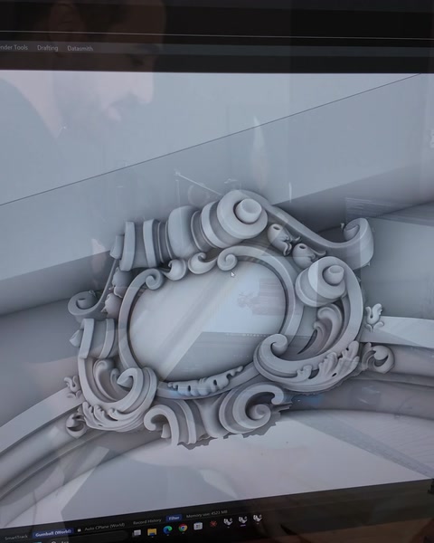 Completed digital model of classical ornamented arch and oval rosette shown.