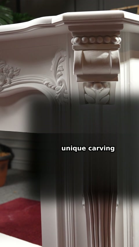 Detailed leaf carvings decorate the white polyurethane fireplace surround column.