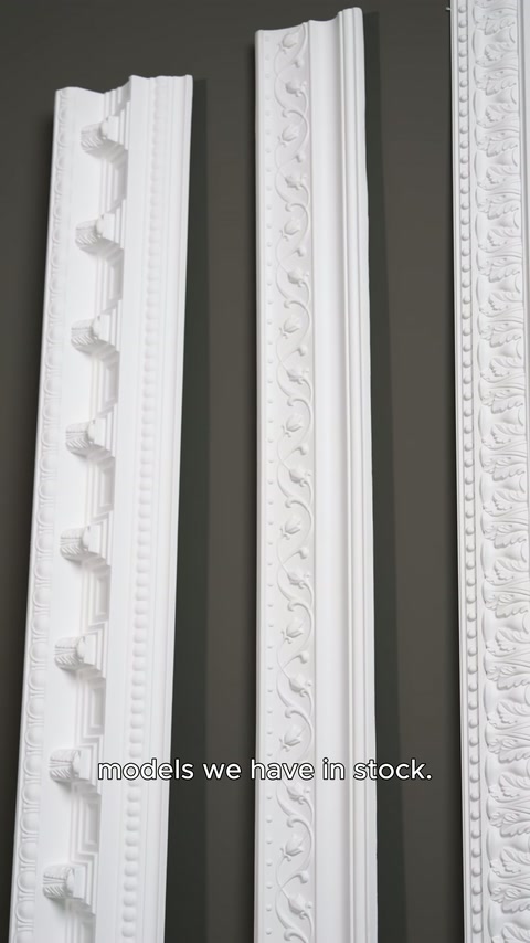 Carved polyurethane profiles positioned vertically before product photography