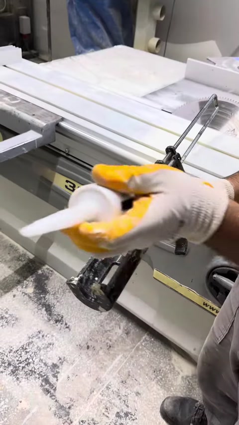Assembly material is placed into an application gun at the production bench