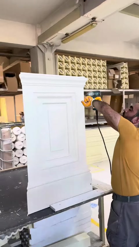 The assembled pilaster column capital is processed on the workbench