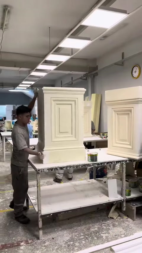Pilaster column capitals at different stages are displayed in the workshop