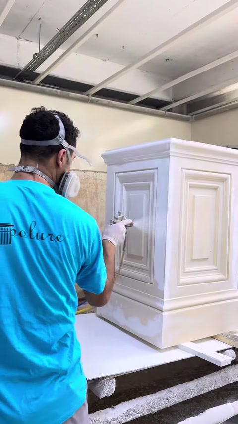 A surface coating is applied to the pilaster column capital by spraying