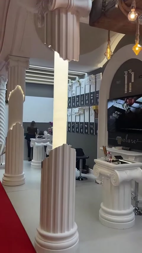 An arched stand entrance is completed with decorative columns and displayed profile samples