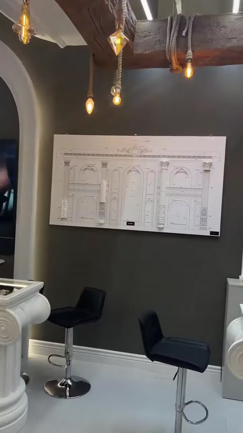 A panel showing column and door surround designs is placed beneath a wall arch