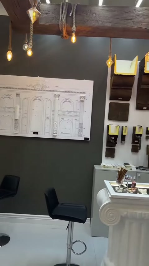 Wall panel displays door surround sketches and various decorative profile samples