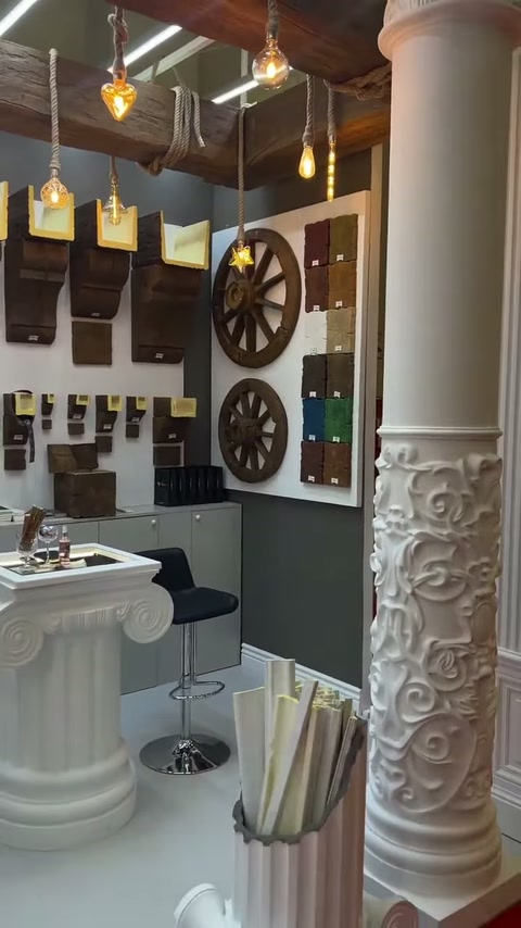 Embossed antique column stands out in front of the sample wall