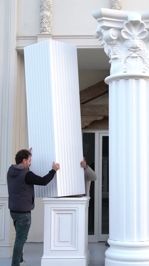 The video shows the installation of different polyurethane column models on an exterior facade.