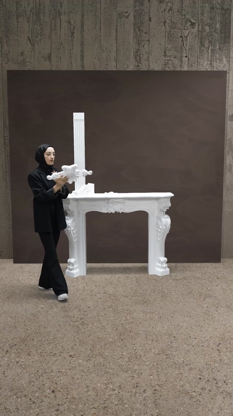 The ornament piece joining the mouldings above the fireplace is shown