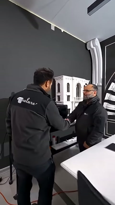 Product inspection is conducted at a booth surrounded by white decorative pieces.