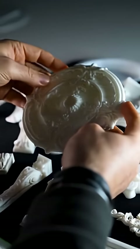 The back surface of a flower-shaped ceiling rose is turned toward the camera.