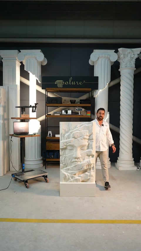 Showroom presenter displays separate sculpted polyurethane relief sections between decorative columns.