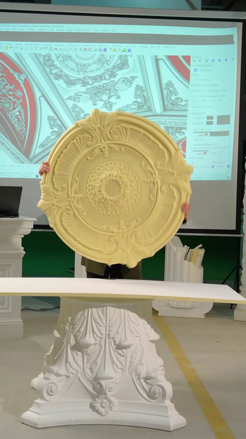 A round ceiling medallion with relief details is displayed in its complete form