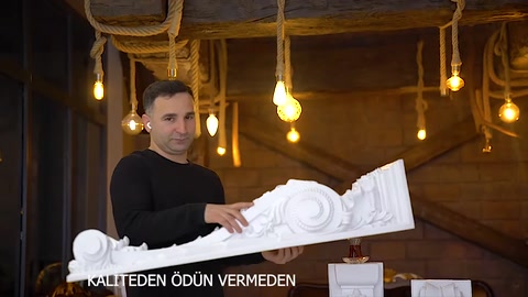The side profile of a decorative corbel is examined while held horizontally