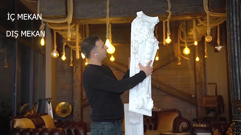 The richly embossed decorations of a large corbel with a broad body are examined