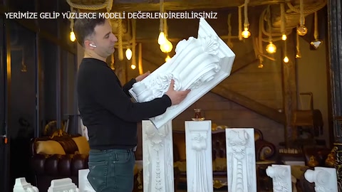 The curved profile of a compact corbel is shown up close by hand