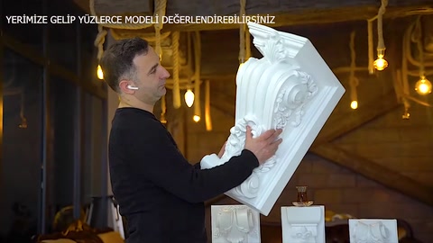 The linear details on the front of a wide curved corbel are examined