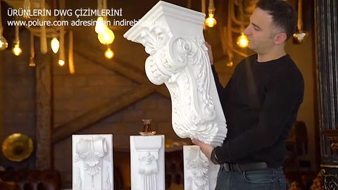 The details of a narrow, ornate corbel are shown while it is held upright