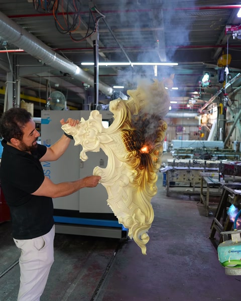 A smoky fire resistance test being performed on a ceiling medallion piece