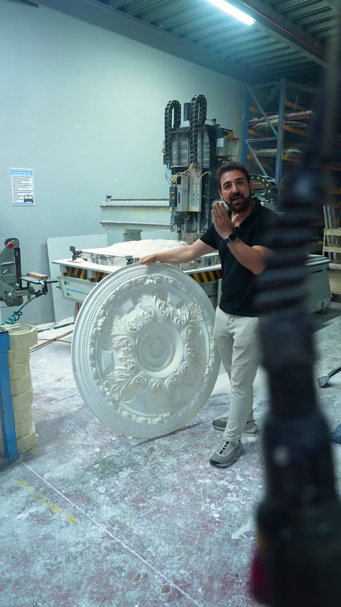 The machined circular ceiling medallion is displayed vertically, showing its patterns.