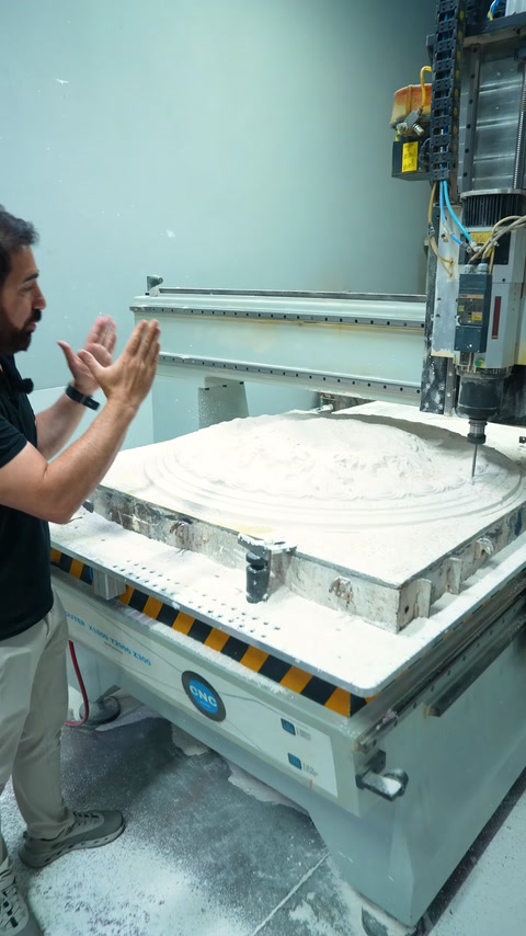 A large circular ceiling medallion mold is seen being prepared for machining on a CNC machine.